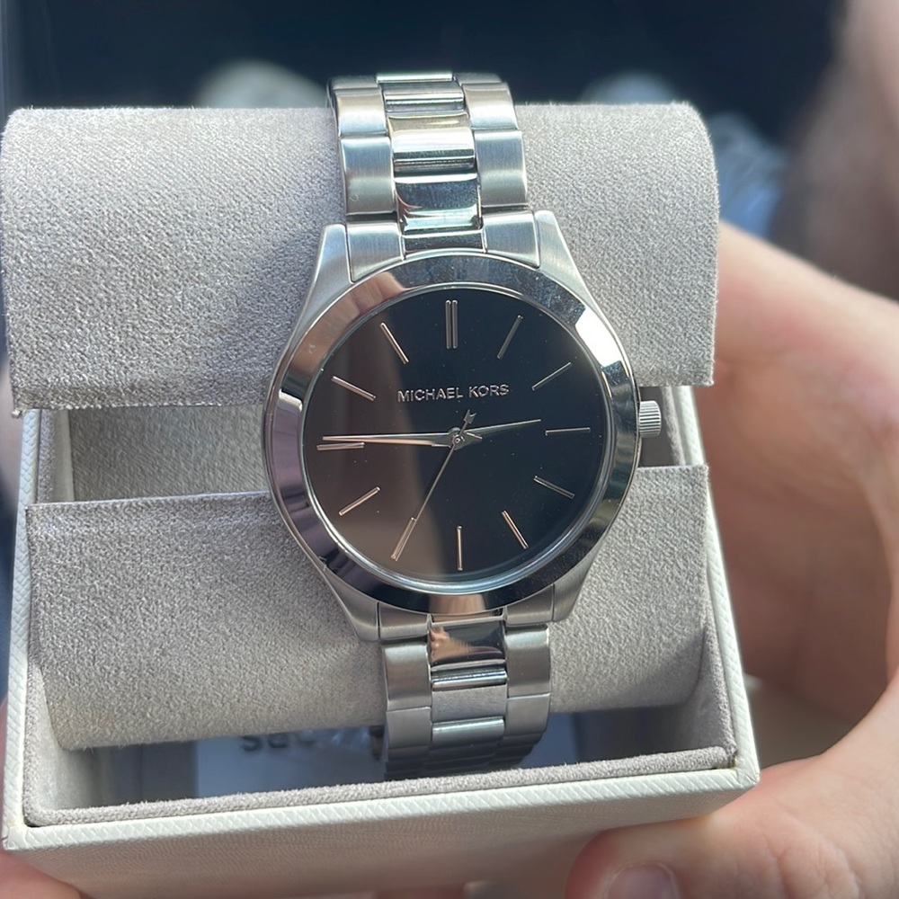 Brand new Michael Kors watch. Never worn, has extra bands to add length